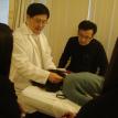 Dr. Liu teaching his student cautious manipulation at head area